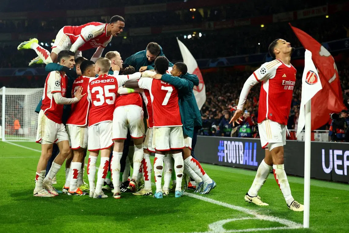 Soccer Football - Champions League - Round of 16 - Second Leg - Arsenal v FC Porto - Emirates Stadium, London, Britain - March 12, 2024 Arsenal players celebrate after the match REUTERS/Hannah Mckay