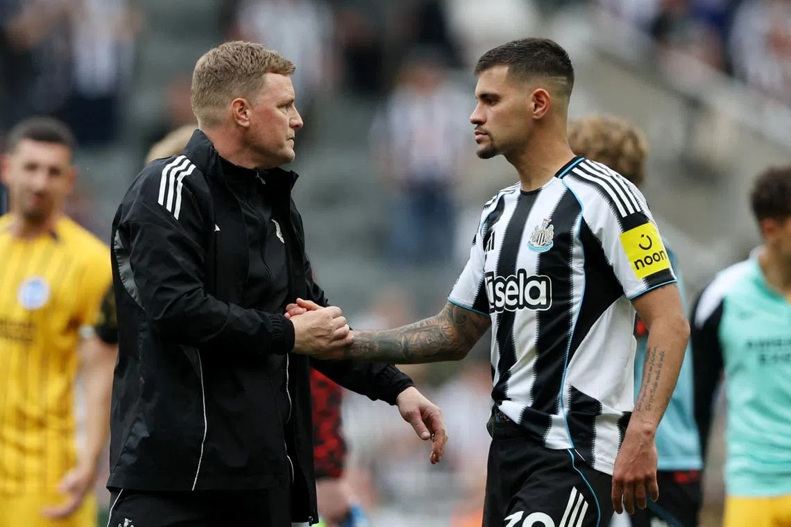 FILE PHOTO: Soccer Football - Premier League - Newcastle United v Brighton & Hove Albion - St James' Park, Newcastle, Britain - May 2, 2026 Newcastle United manager Eddie Howe shakes hands with Bruno Guimaraes after the match REUTERS/Scott Heppell/ File Photo