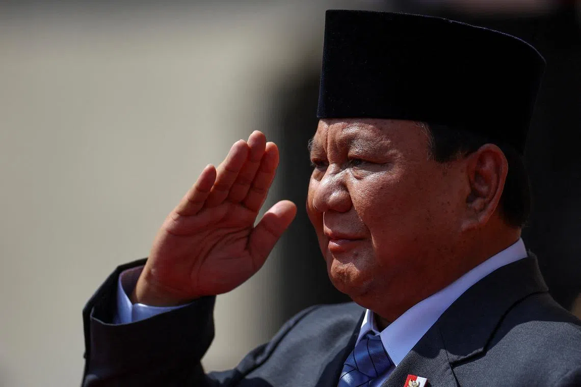 FILE PHOTO: Indonesian President Prabowo Subianto salutes during a welcoming ceremony at the government palace, on the sidelines of the Asia-Pacific Economic Cooperation (APEC) summit, in Lima, Peru November 14, 2024. REUTERS/Agustin Marcarian/File Photo