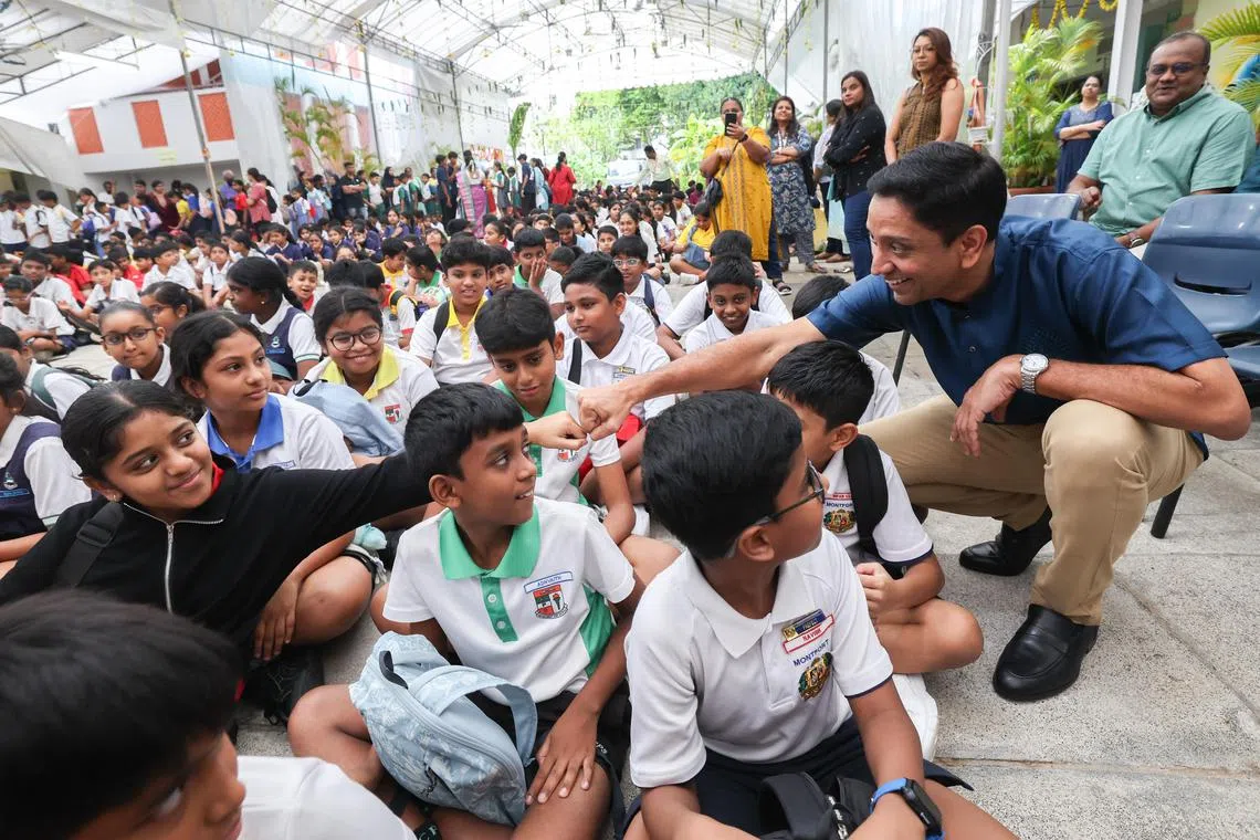 Minister of State for Culture, Community and Youth Dinesh Vasu Dash interacting with students at the Umar Pulavar Tamil Language Centre on Aug 23.