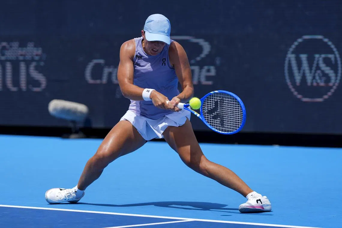 Iga Swiatek returns a shot against Elena Rybakina during the Cincinnati Open at the Lindner Family Tennis Centre.