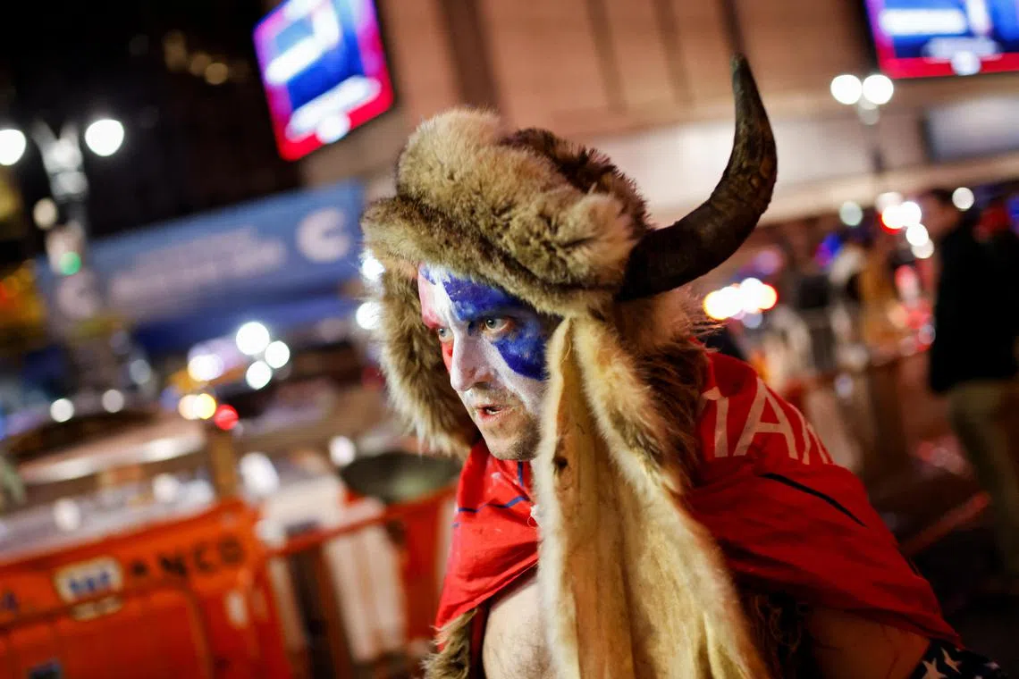 A person dressed like a viking walks outside of Madison Square Garden during a rally for Republican presidential nominee Donald Trump, in New York, on Oct 27.