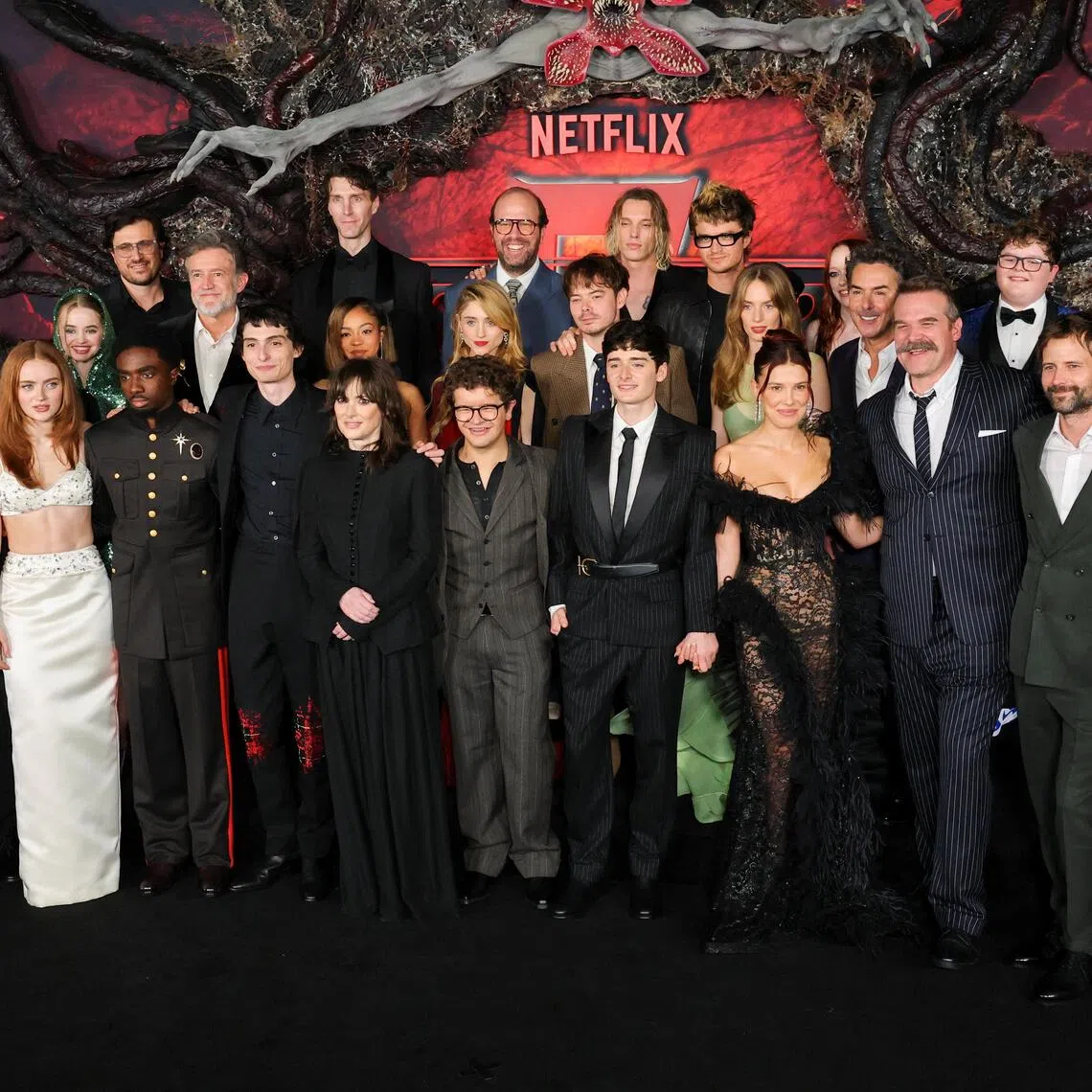 Cast members Sadie Sink, Caleb McLaughlin, Finn Wolfhard, Gaten Matarazzo, Noah Schnapp, Millie Bobby Brown, Joe Keery, Maya Hawke, Winona Ryder, David Harbour and Natalia Dyer, and creators Matt Duffer and Ross Duffer, along with other cast members at the premiere for the final season of Stranger Things at the TCL Chinese Theatre in Los Angeles on Nov 6.