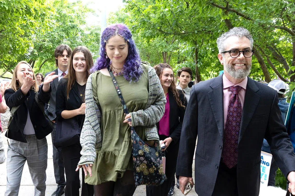 Ms Rikki Held (third from left) is among a group of young people suing the Montana state government.