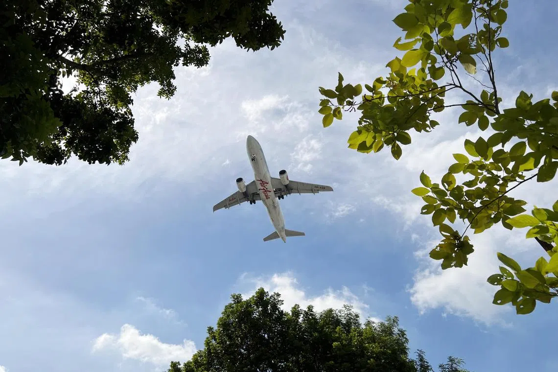 An AirAsia aircraft flying over Changi South on 6 January 2023.