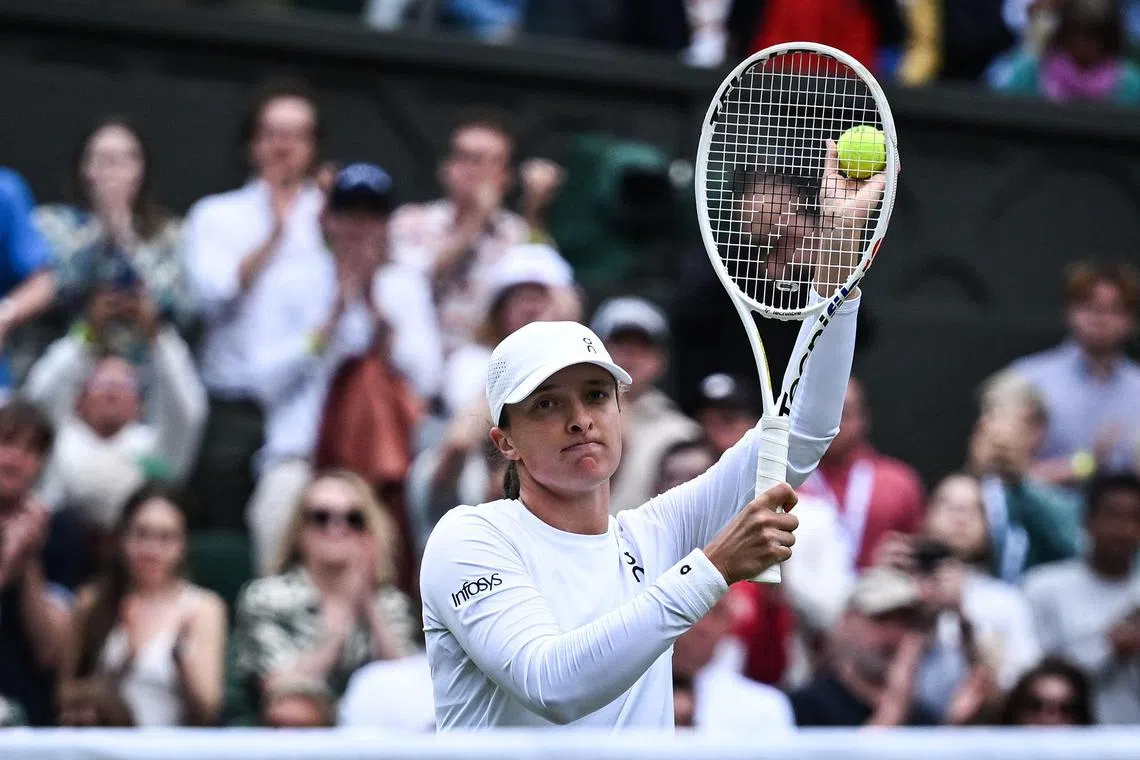 Poland's Iga Swiatek celebrates winning her second-round match against Croatia's Petra Martic.
