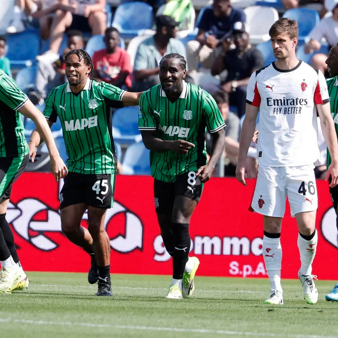 Sassuolo's Armand Lauriente (second from left) celebrates with teammates after scoring their second goal in the 2-0 win over AC Milan in the Italian Serie A in Reggio Emilia, Italy on May 3, 2026.