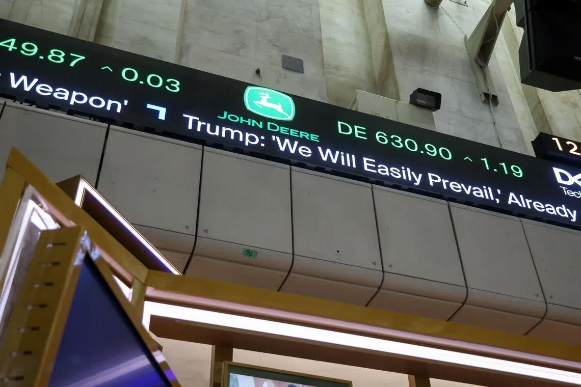 News from US President Donald Trump's speech displayed on the floor of the New York Stock Exchange on March 2, 2026.