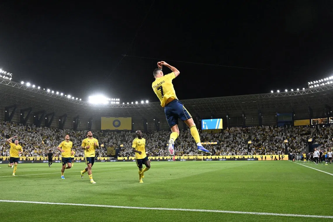 Soccer Football - Saudi Pro League - Al Nassr v Al Najmah - Al Awwal Park, Riyadh, Saudi Arabia - April 3, 2026 Al Nassr's Cristiano Ronaldo celebrates scoring their third goal with teammates REUTERS/Stringer