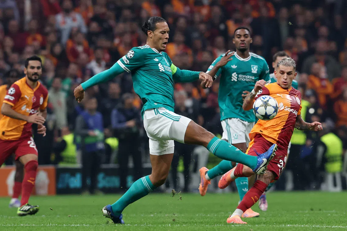 Soccer Football - UEFA Champions League - Galatasaray v Liverpool - Rams Park, Istanbul, Turkey - September 30, 2025 Liverpool's Virgil van Dijk in action with Galatasaray's Lucas Torreira REUTERS/Dilara Senkaya