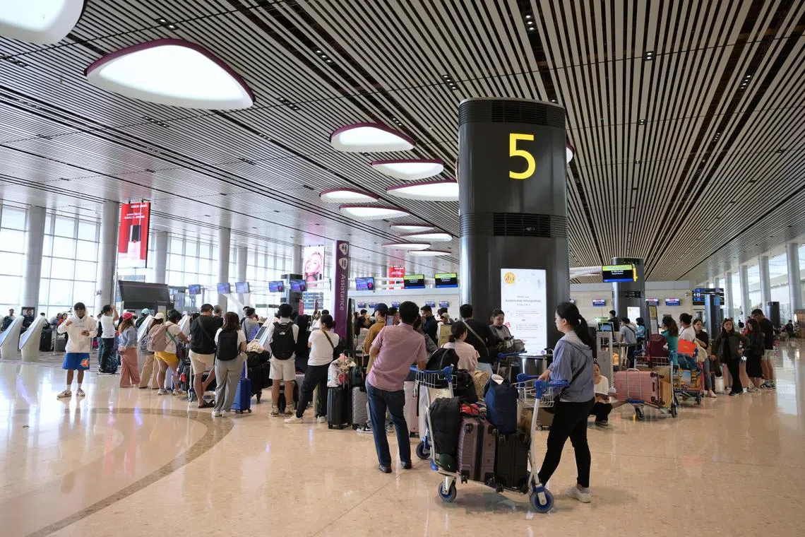 Passengers queueing at Cebu Pacific Air check-in counters at Changi Airport Terminal 1 due to the IT outage on July 19, 2024. Changi Airport Group (CAG) stated that due to a global outage affecting the IT systems of many organizations, the check-in process for some airlines at Changi Airport is being managed manually.