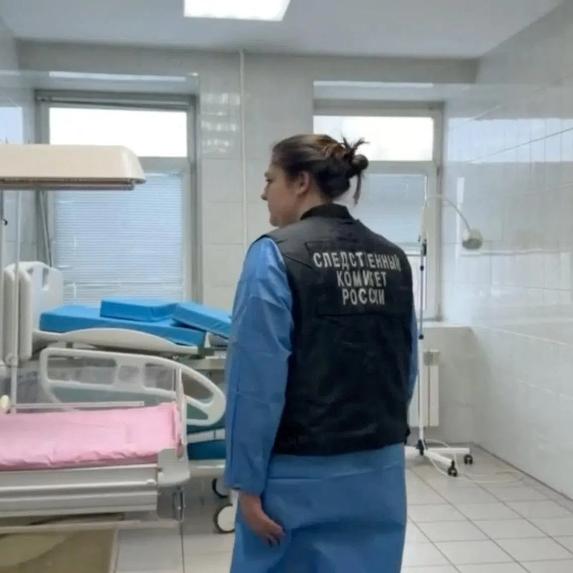An investigator inspecting a delivery room at a maternity hospital in Novokuzhetsk, Russia, where nine newborn babies died in January.