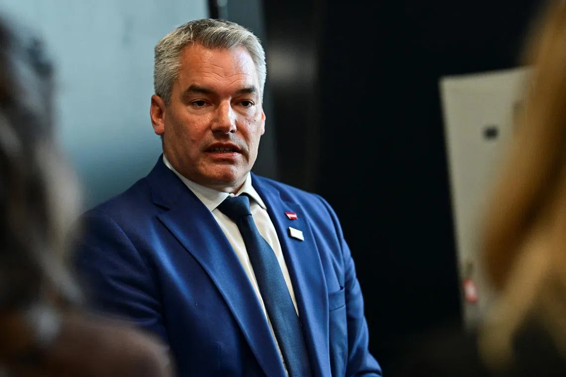 FILE  PHOTO: Chancellor of Austria, Karl Nehammer speaks at the informal EU Summit at the Puskas Arena, in Budapest, Hungary, November 8, 2024. REUTERS/Marton Monus/File Photo