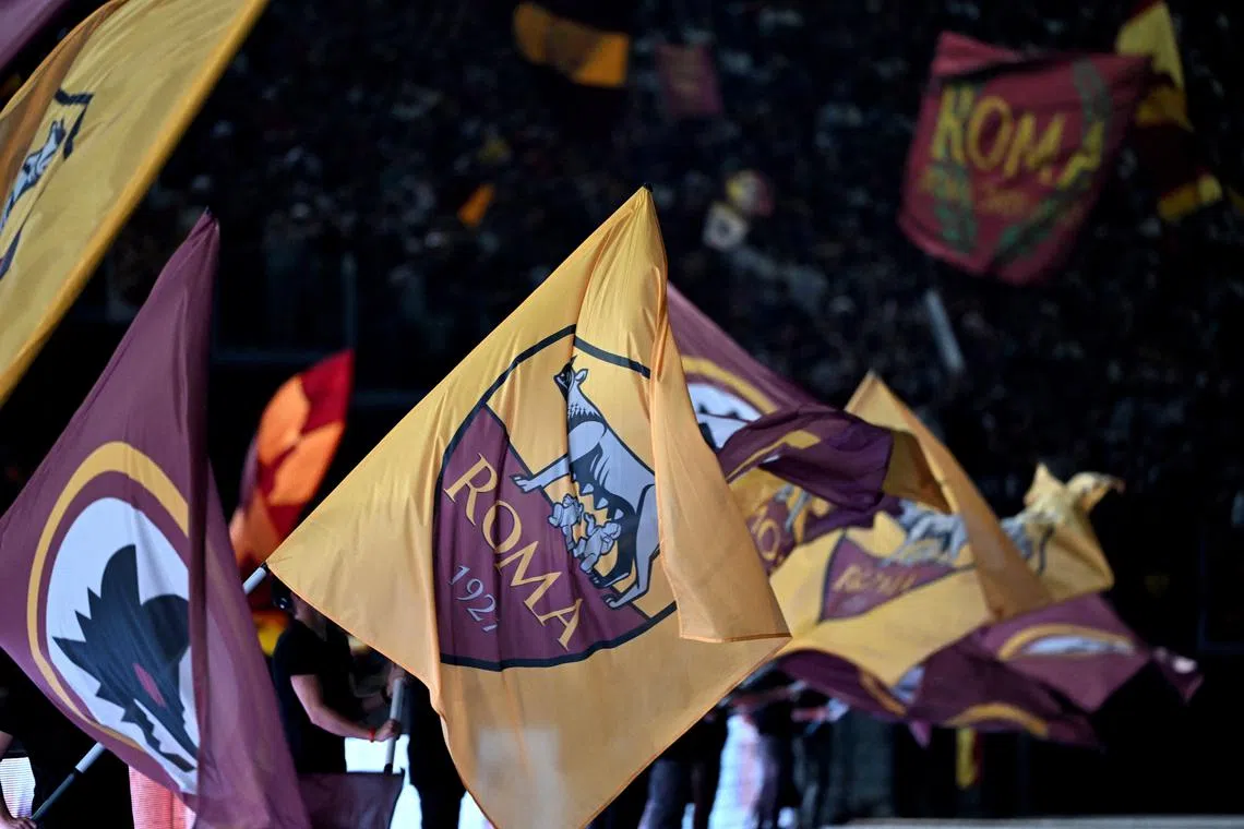 FILE PHOTO: Soccer Football - Serie A - AS Roma v Empoli - Stadio Olimpico, Rome, Italy - August 25, 2024 AS Roma fans wave flags inside the stadium before the match REUTERS/Alberto Lingria/File Photo