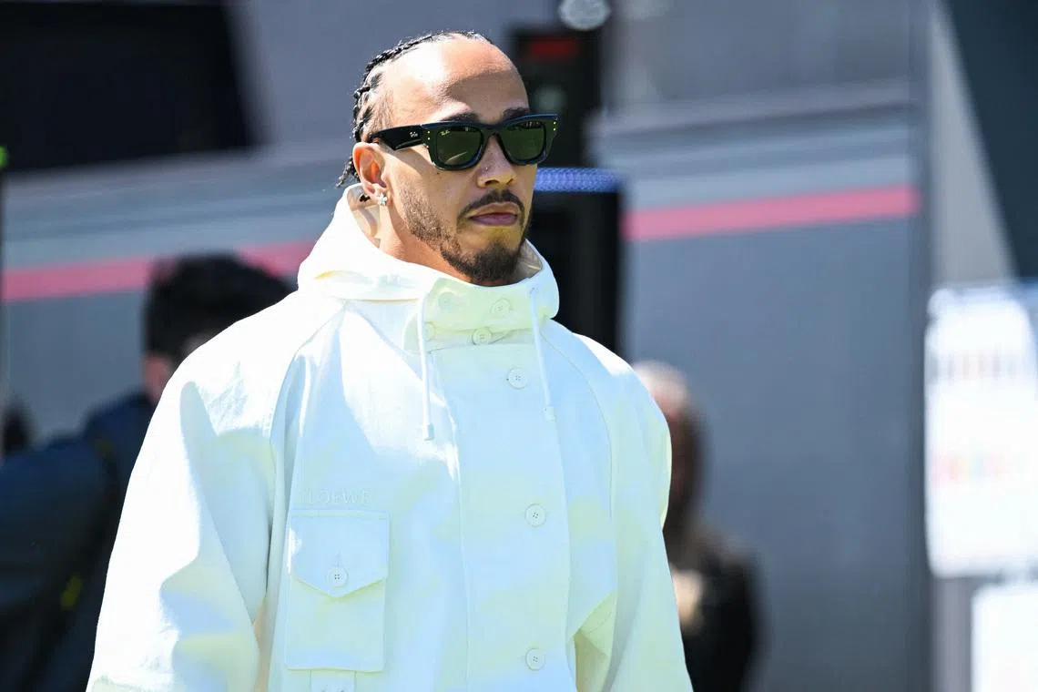 May 21, 2026; Montreal, Quebec, CANADA; Ferrari driver Lewis Hamilton (44) arrives to the paddock area at Circuit Gilles-Villeneuve. Mandatory Credit: David Kirouac-Imagn Images