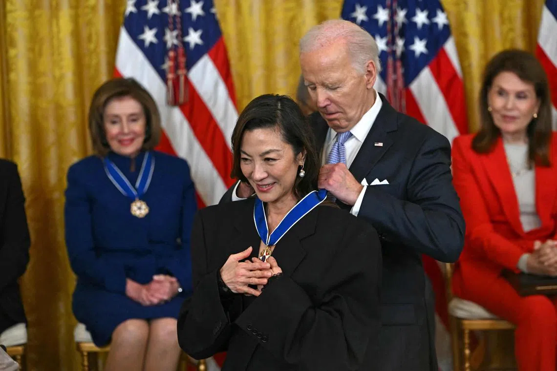 US President Joe Biden presents the Presidential Medal of Freedom to Malaysian actress Michelle Yeoh in the East Room of the White House in Washington DC, on May 3.