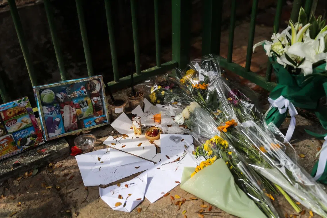 Items left next to the canal where the twin boys' bodies were found in January 2022.
