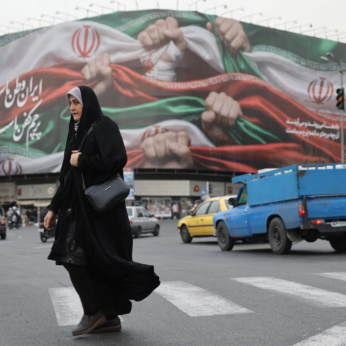 An Iranian woman walks on a street in Tehran, Iran, January 19, 2026. Majid Asgaripour/WANA (West Asia News Agency) via REUTERS
