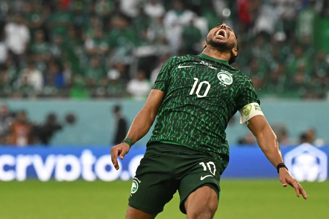 Saudi Arabia midfielder Salem Al-Dawsari reacts after missing a shot at goal during the match against Poland.