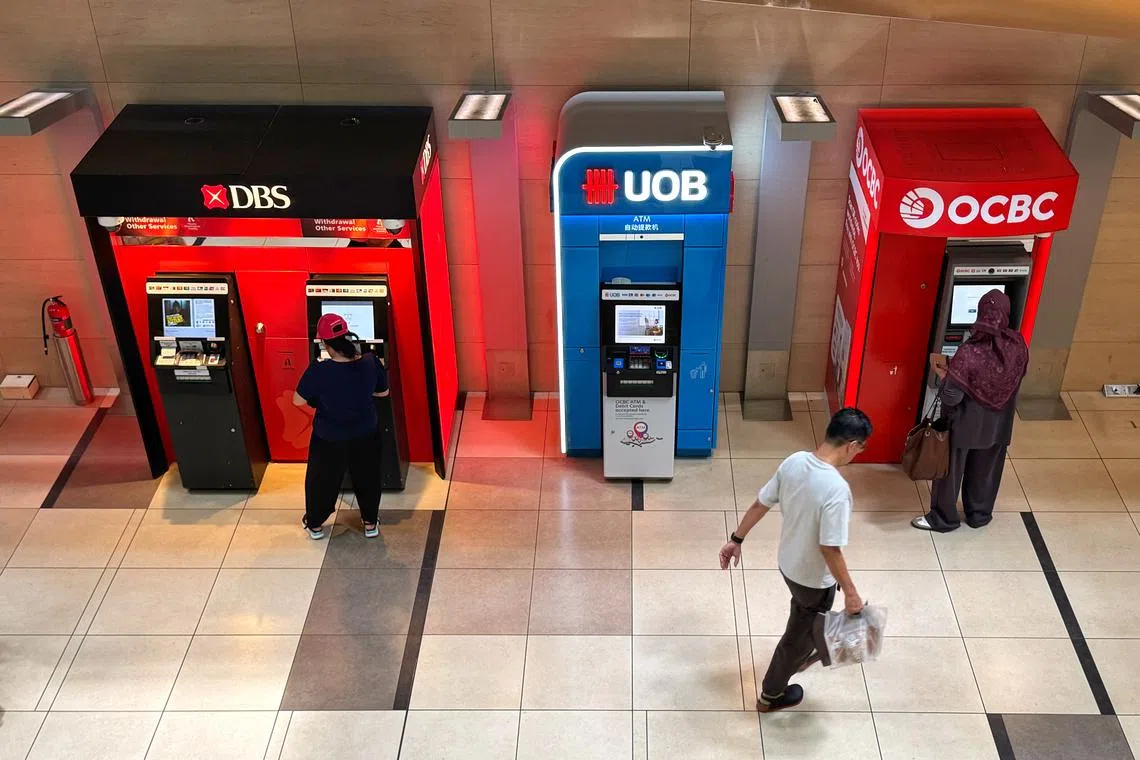 Pixgeneric- Generic photo of DBS, UOB and OCBC ATMs taken at Changi Airport terminal 3 on Dec 7, 2024. Can be used for bank, banking and finance, economy, money, business stories.
