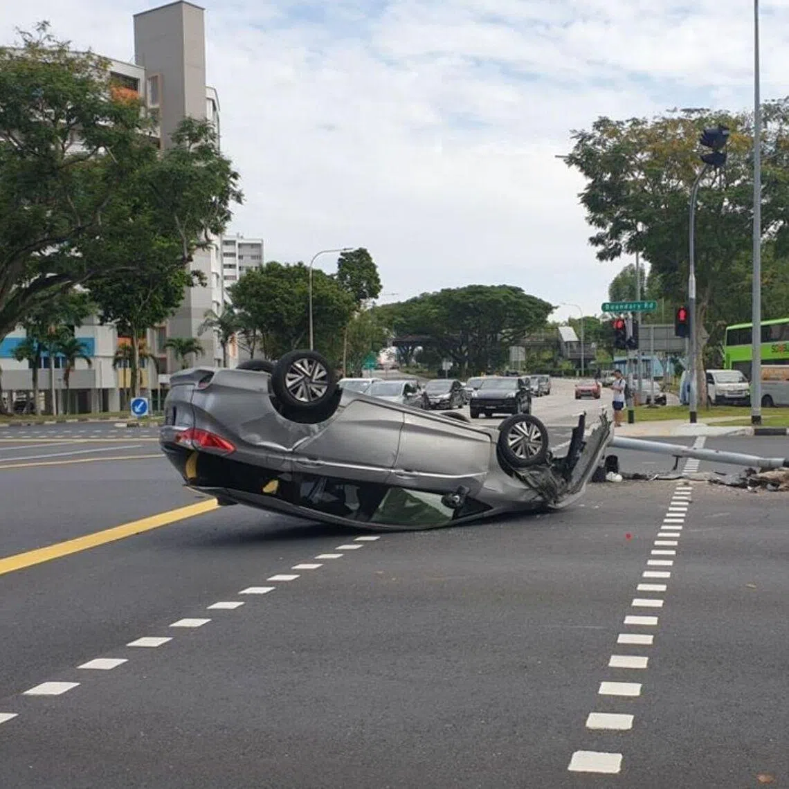 The car driven by the man overturned after it collided into a traffic light pole at the junction of Yio Chu Kang Link and Boundary Road on Feb 2, 2025.