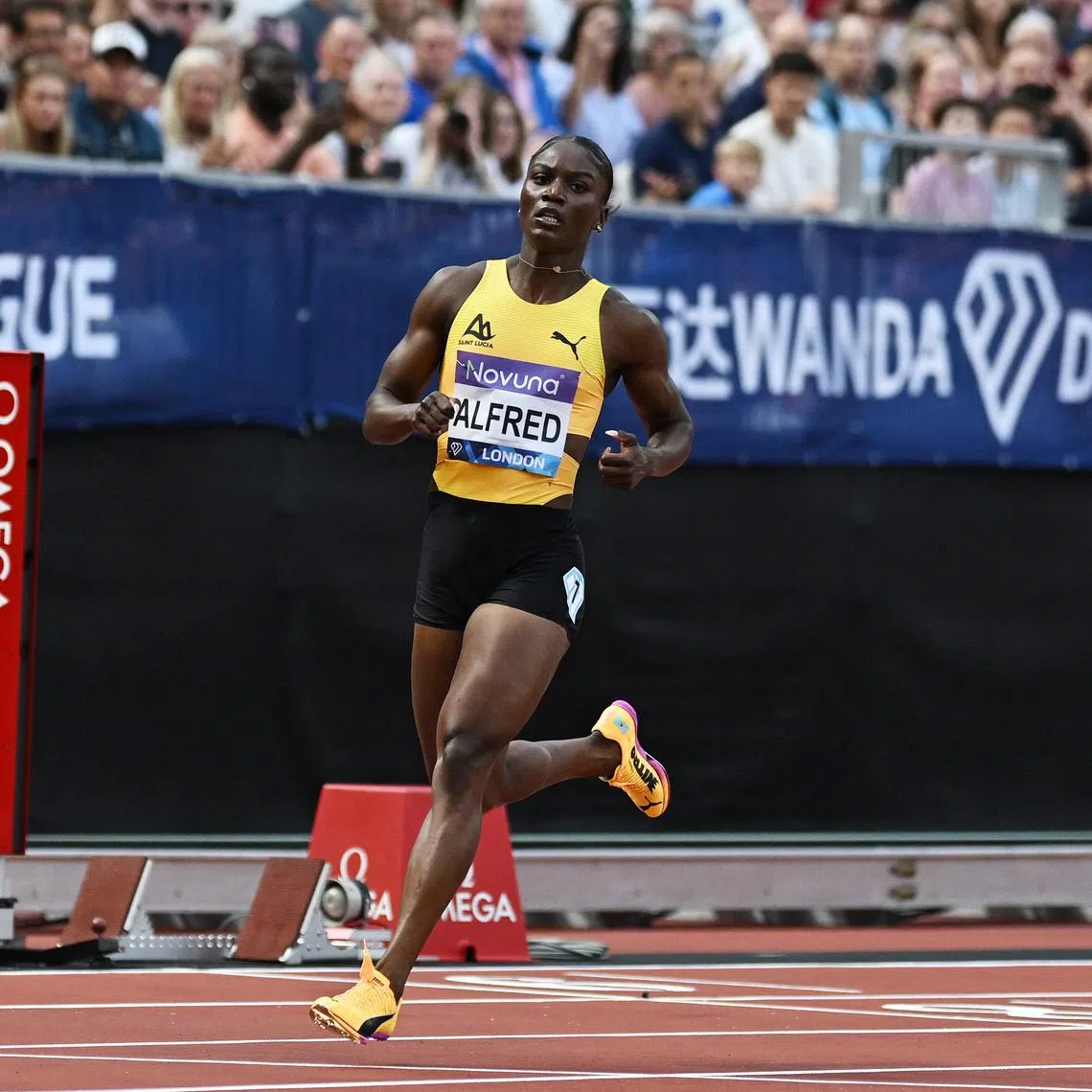 FILE PHOTO: Athletics - Diamond League - London - London Stadium, London, Britain - July 19, 2025 St Lucia's Julien Alfred celebrates after winning the Women's 200m final REUTERS/Dylan Martinez/File Photo