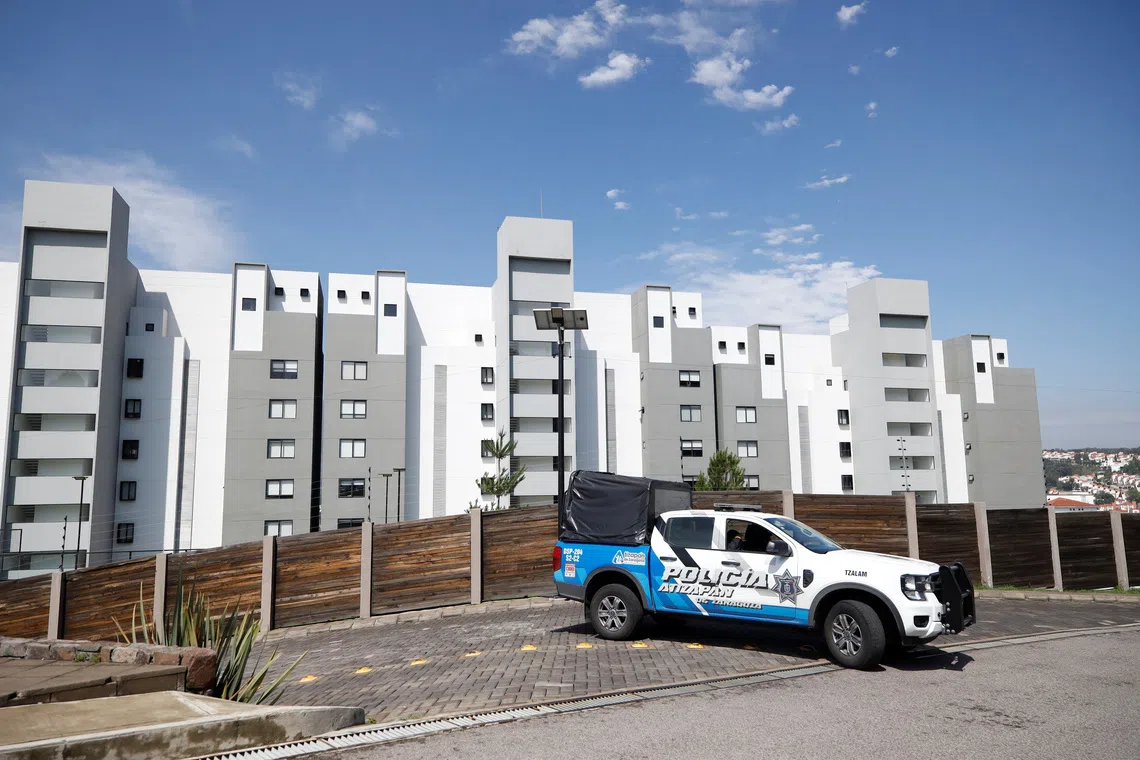 Municipal police officers guard the apartment complex where Jonathan Melendez, a Mexican musician who played keyboard for the indie rock band Camilo Septimo, his pregnant wife, their 3-year-old daughter, a domestic worker and the family's dog were found tied up and shot dead in a penthouse in an upscale residential development in Atizapan de Zaragoza, on the outskirts of Mexico City, Mexico, September 3, 2026. REUTERS/Luis Cortes