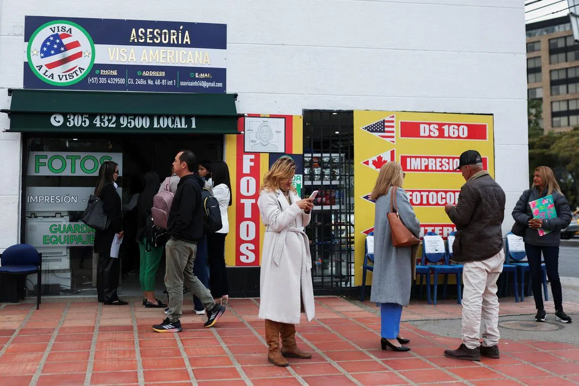 People who had an appointment scheduled for the visa process to the United States and were cancelled, wait outside the United States embassy for some rescheduling information, in Bogota, Colombia January 27, 2025. REUTERS/Luisa Gonzalez