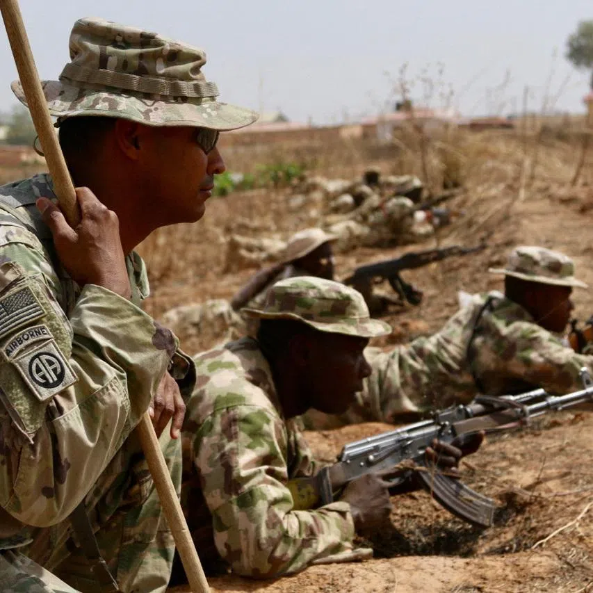 A U.S. Army soldier (L) trains Nigerian Army soldiers at a military compound in Jaji, Nigeria, February 14, 2018.    Capt. James Sheehan/U.S. Army/Handout via REUTERS