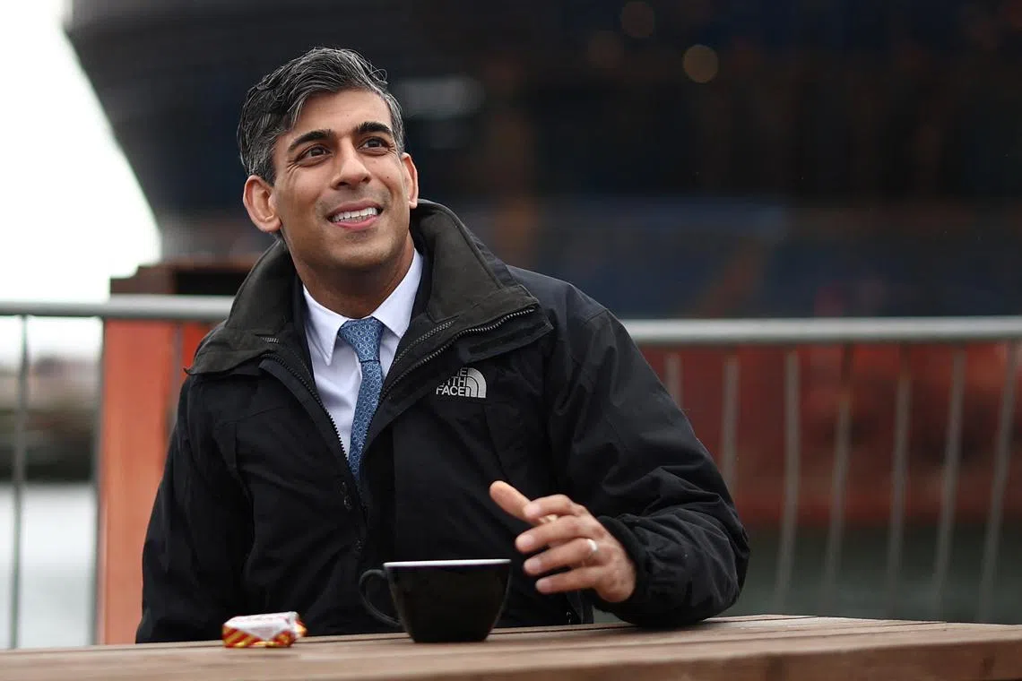 Britain's Prime Minister and Conservative Party leader Rishi Sunak is seen during a visit to the Global Energy Group facility at the Port of Nigg, as part of a campaign event ahead of a general election on July 4, in Scotland, on May 23, 2024. 