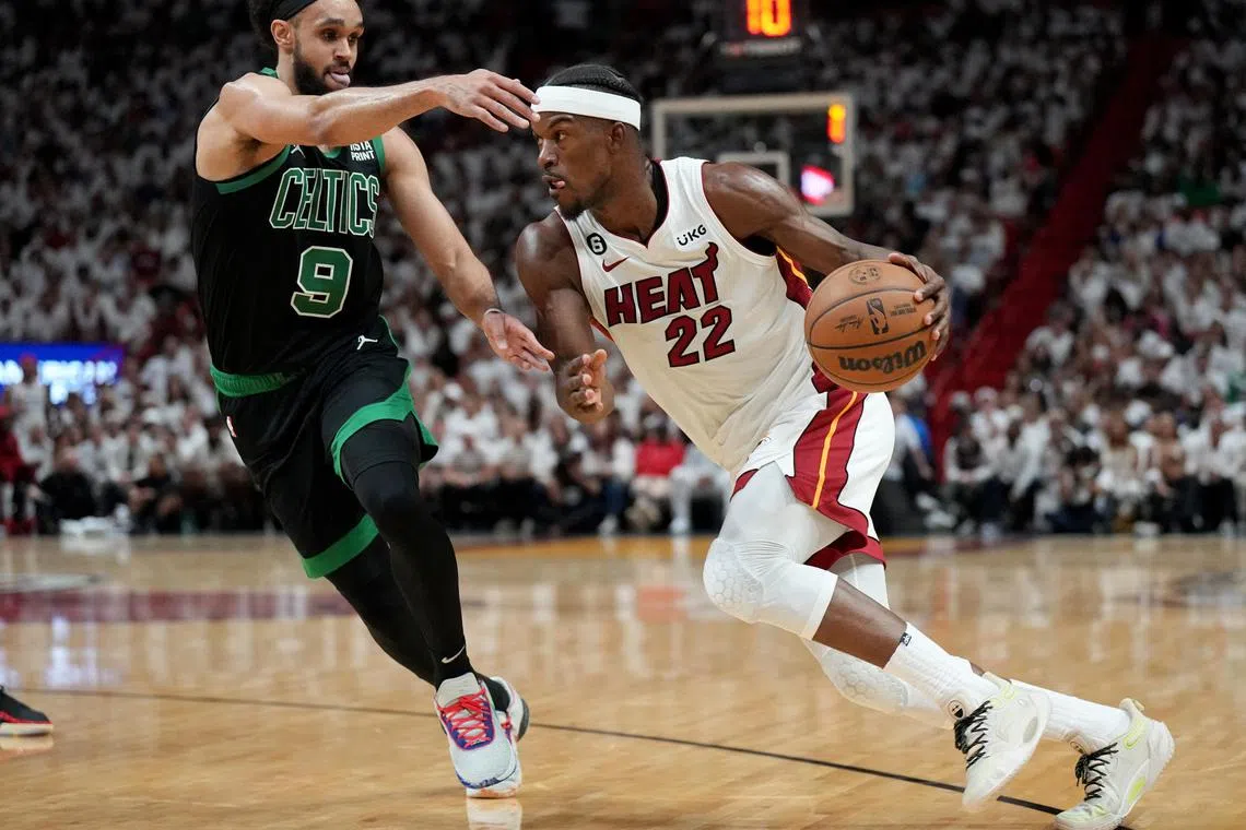 Miami Heat forward Jimmy Butler driving against Boston Celtics guard Derrick White during game three of the NBA Eastern Conference Finals. He scored 16 points as Miami won 128-102 for a 3-0 series lead. 