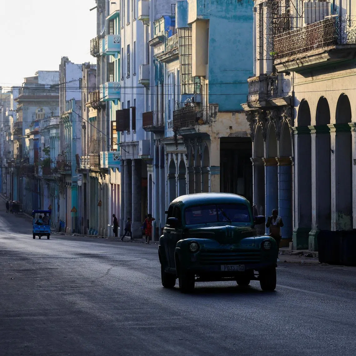 A vintage car drives down a street ahead of an announcement by Cuba's grid operator UNE that it had reconnected most of the country to the national grid, though millions remained without power as the country struggles to generate even one-third of current demand amid an ongoing U.S. fuel blockade, in Havana, Cuba, July 7, 2026. REUTERS/Norlys Perez