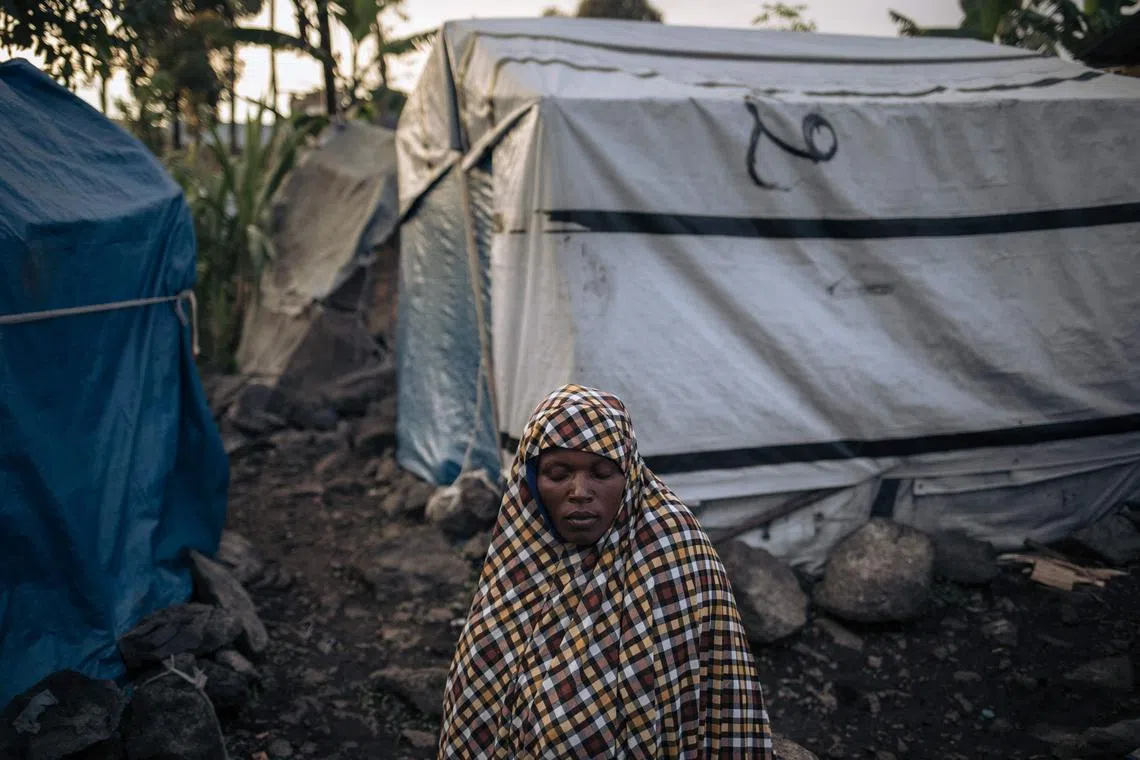 A displaced Muslim woman waits for nightfall to break the Ramadan fast in Goma, eastern Democratic Republic of Congo, March 27.