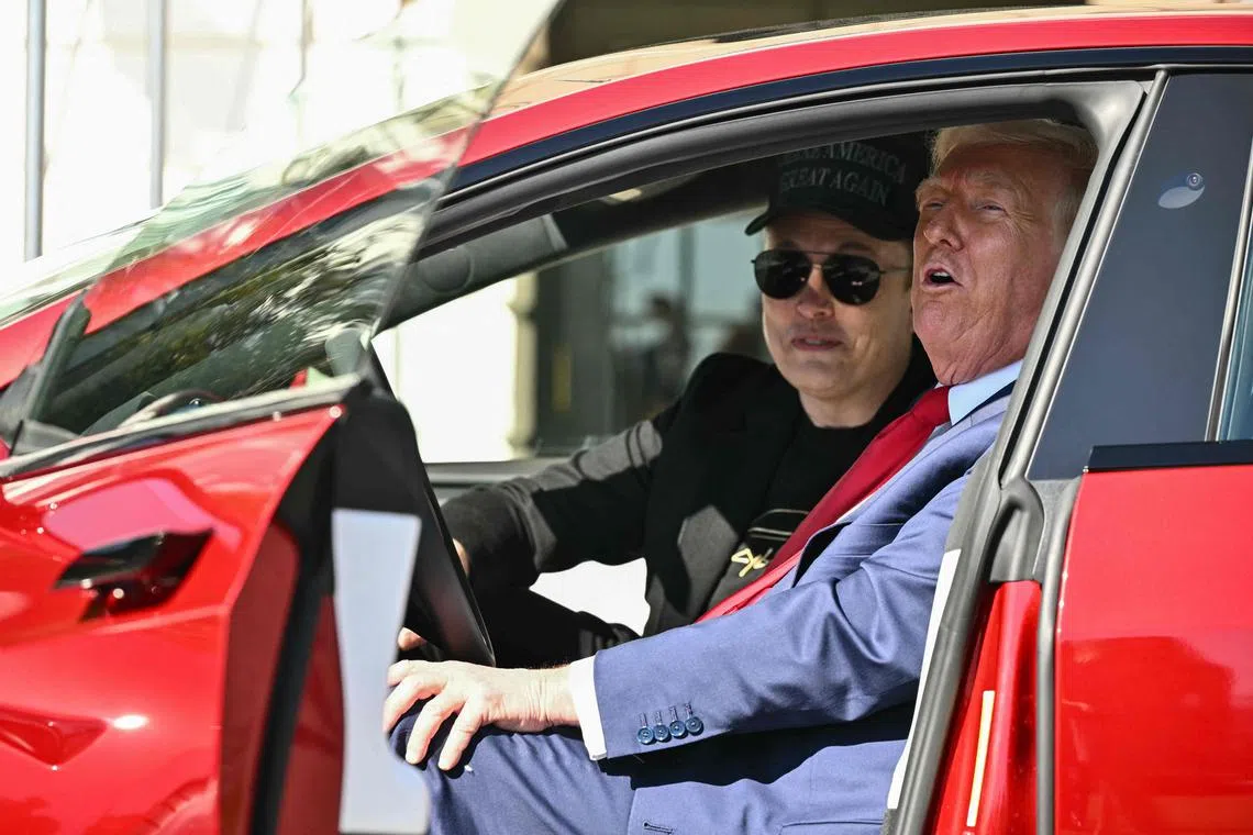 President Donald Trump inside a Tesla vehicle with his then close ally Elon Musk during a publicity stunt in March.