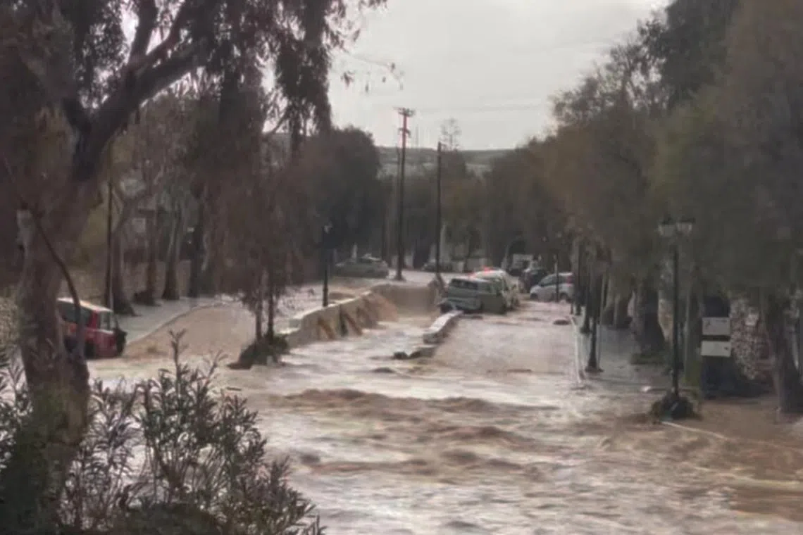 Stranded vehicles are seen in flood water in Naoussa, in the island of Paros, Greece March 31, 2025 in this screen grab from social media video. Lorene Junillon/via REUTERS  THIS IMAGE HAS BEEN SUPPLIED BY A THIRD PARTY. MANDATORY CREDIT. NO RESALES. NO ARCHIVES.