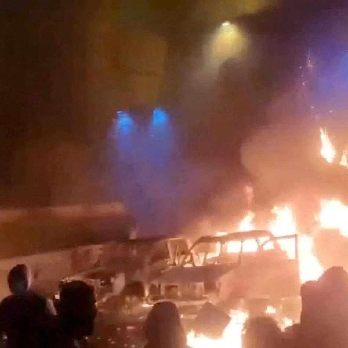 Protesters gather as vehicles burn, amid evolving anti-government unrest, in Tehran, Iran, in this screengrab obtained from a social media video released on Jan 9.
