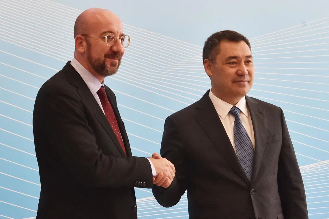 Kyrgyz President Sadyr Japarov (right) greets President of the European Council Charles Michel during the second EU-Central Asia summit in Cholpon-Ata, on June 2.