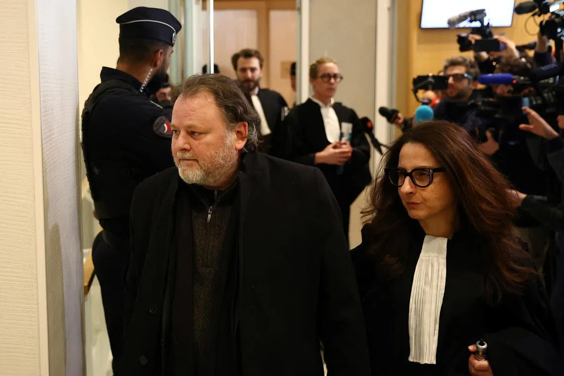 French film director Christophe Ruggia leaves with her lawyer Orly Rezlan after the verdict in his trial for sexually abusing actress Adele Haenel on set while she was an adolescent, at the criminal court in Paris, France, February 3, 2025. REUTERS/Abdul Saboor