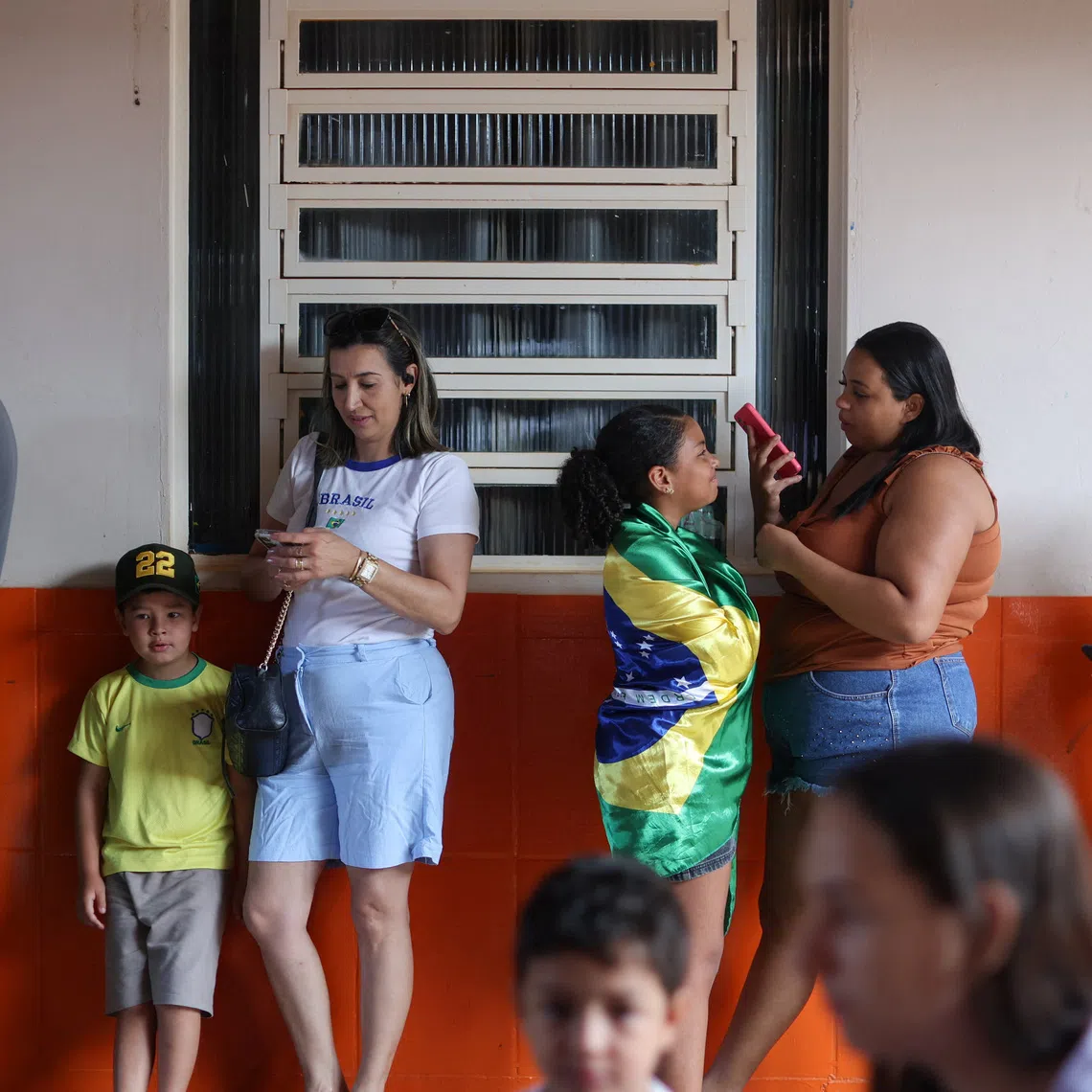 People queue to vote during Brazil's presidential runoff election, in Brasilia, Brazil, October 25, 2026. REUTERS/Adriano Machado