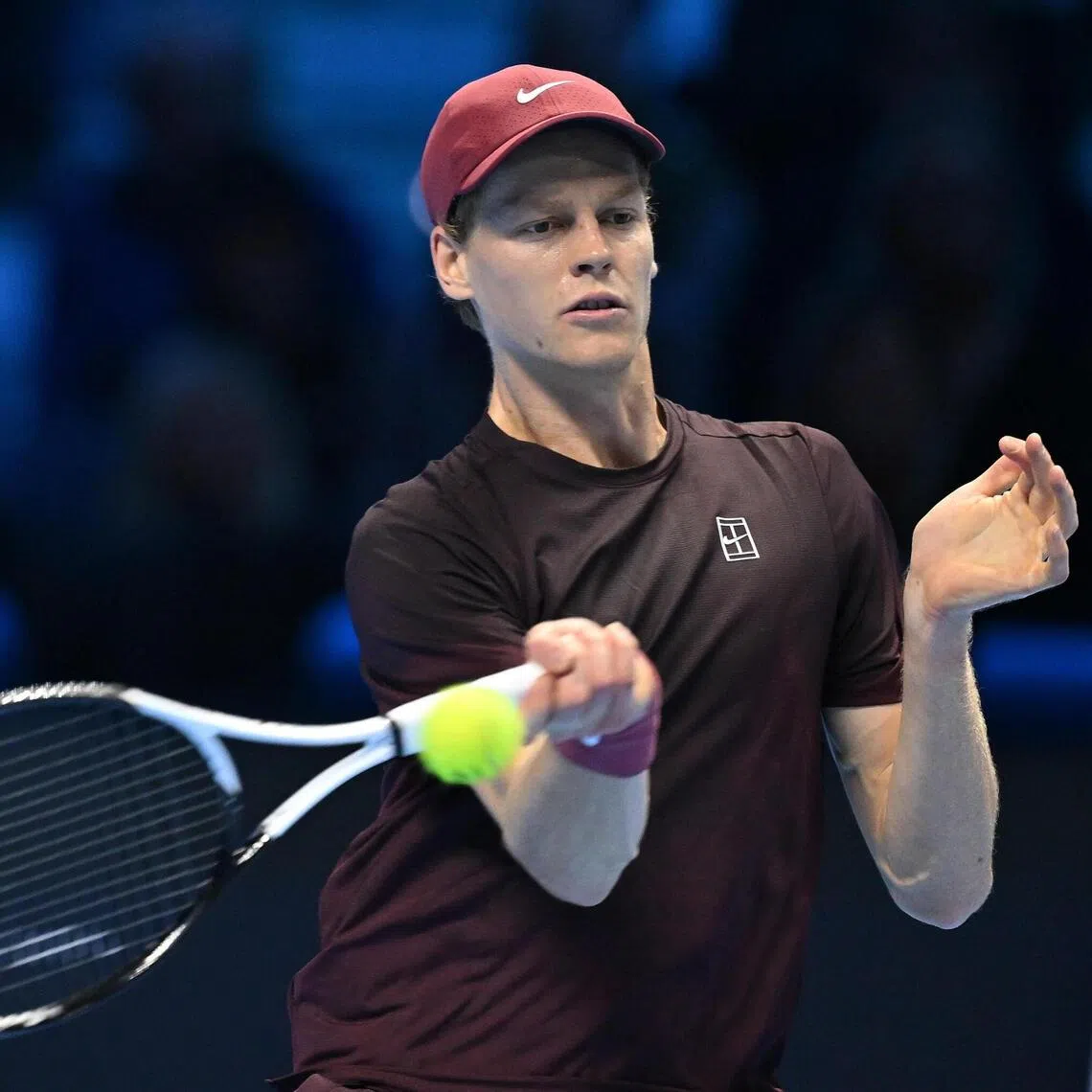 Jannik Sinner of Italy returning a shot during the men's singles semi-final match against Alex de Minaur of Australia at the ATP Finals in Turin on Nov 15. The Italian won 7-5, 6-2.