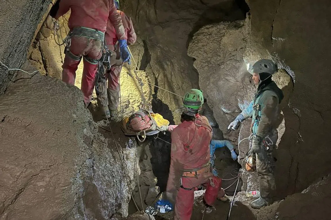 Italian Alpine rescuers (CNSAS) carry U.S. caver Mark Dickey on stretcher as part of a rescue operation in Morca Cave in Mersin province, southern Turkey September 11, 2023. Italian Alpine Rescue/Handout via REUTERS