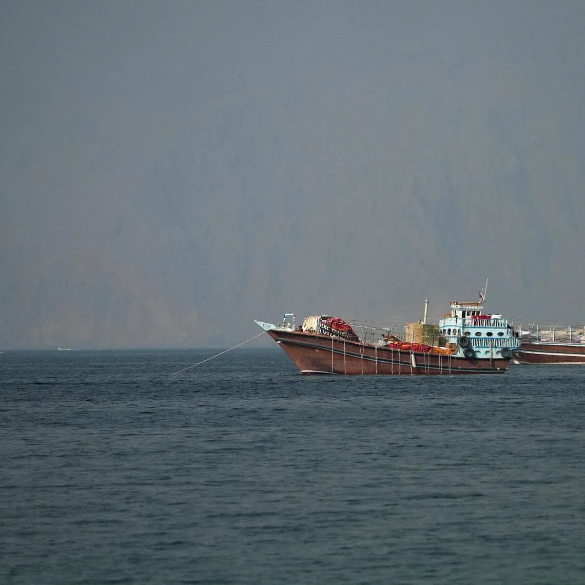 Vessels at the Strait of Hormuz, as seen from Musandam, Oman, June 26, 2026. REUTERS/Stringer