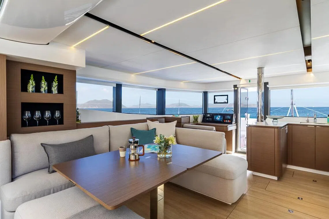 The Leopard 52’s large glass doors connect the forward lounge to a spacious indoor saloon.