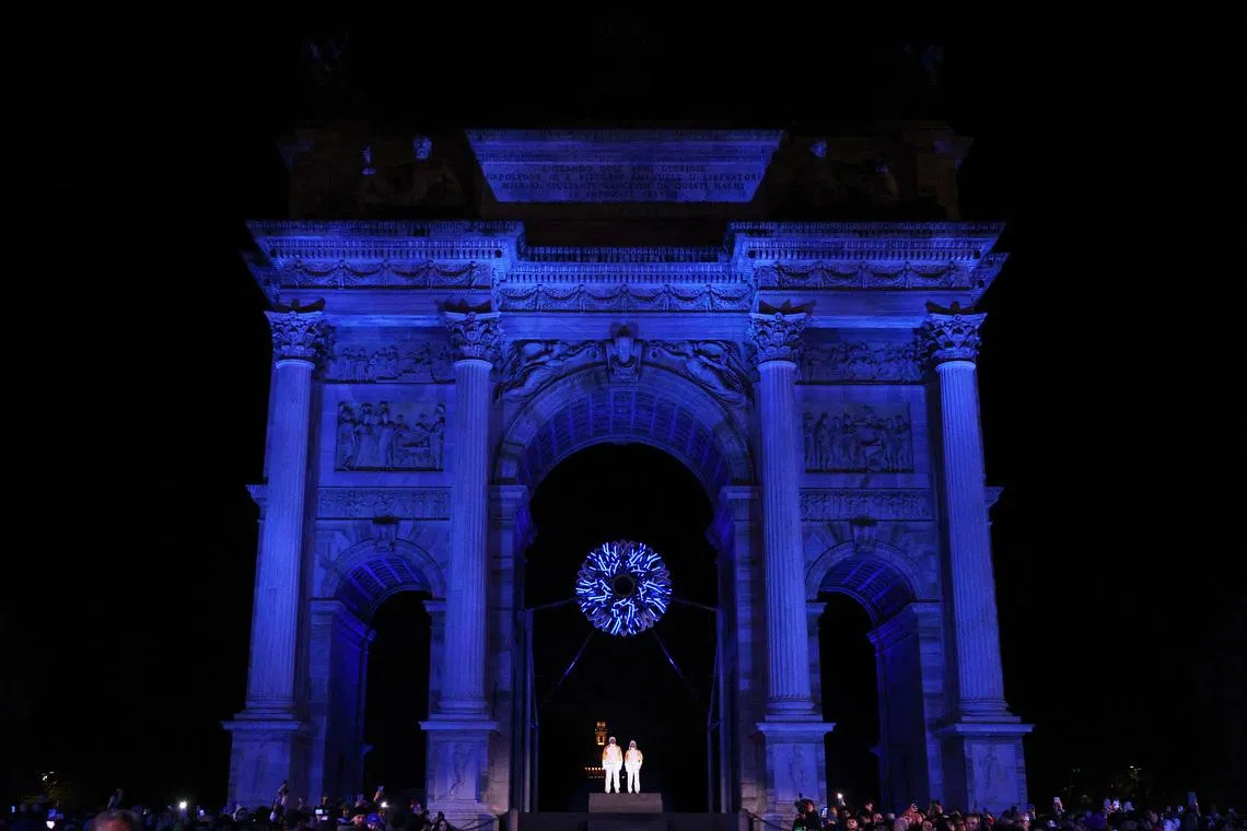 Milano Cortina 2026 Olympics - Opening Ceremony - Arco della Pace, Milan, Italy - February 06, 2026. Alberto Tomba and Deborah Compagnoni stand under the cauldron in Milan during the opening ceremony REUTERS/Guglielmo Mangiapane