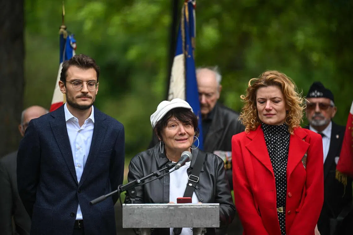 Mrs Oksana Soldin (centre), mother of Arman Soldin, speaking alongside his brother, Sven, and sister, Ena, at the event on May 7. 