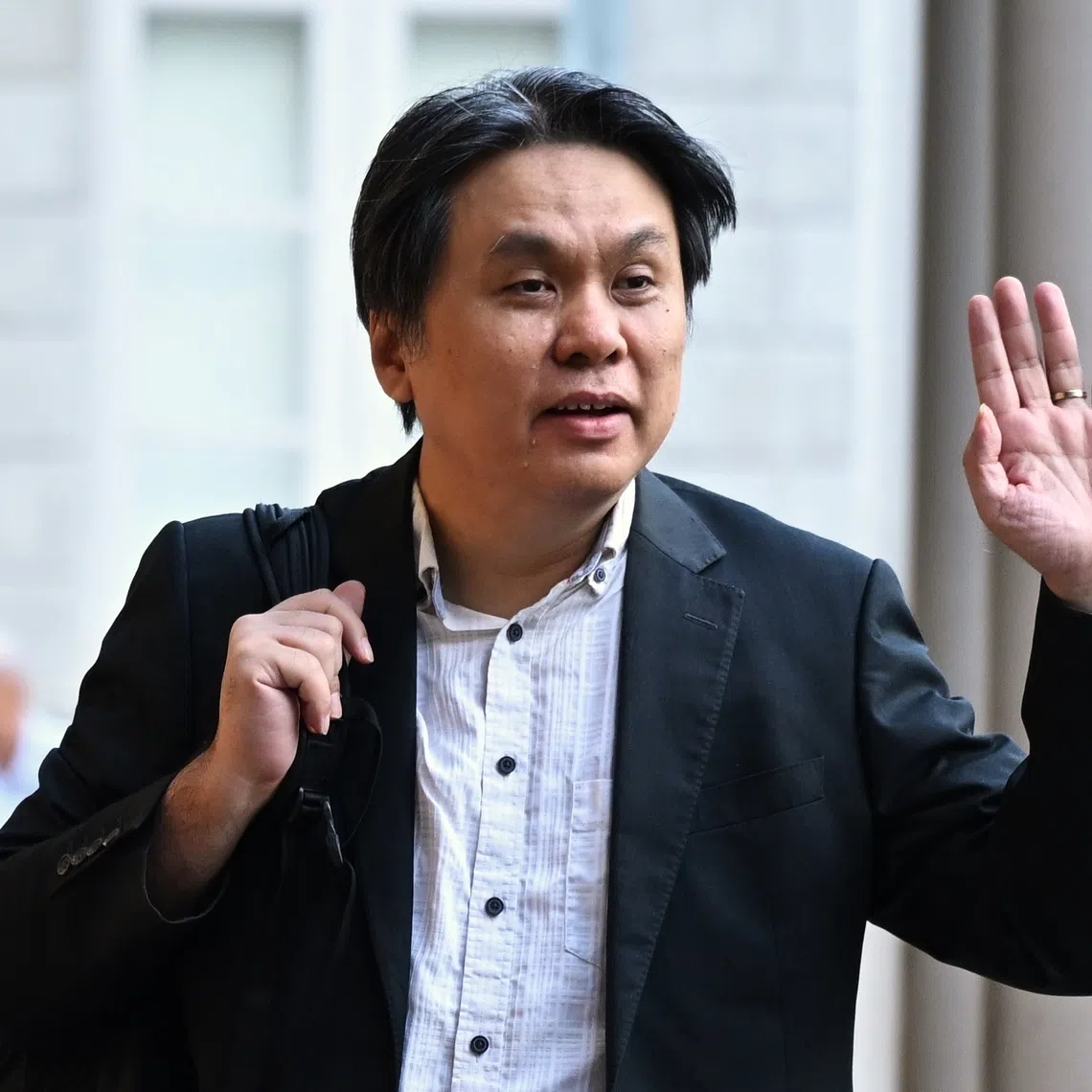 Raymond Ng (right), the husband of anti-vaccine group founder Iris Koh (left), has been barred from starting any new civil legal proceedings