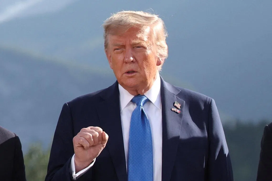 U.S. President Donald Trump gestures as he attends a family photo session during the G7 Summit, in Kananaskis, Alberta, Canada, June 16, 2025. REUTERS/Suzanne Plunkett/Pool