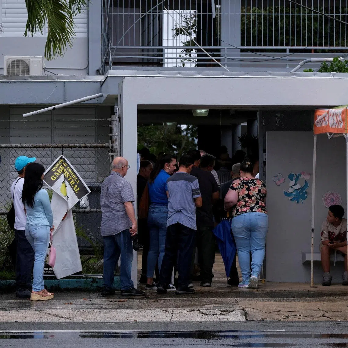 FILE PHOTO: Puerto Ricans line up to cast their ballots during U.S. general elections in San Juan, Puerto Rico, November 5, 2024. REUTERS/Gabriella N. Baez/File Photo