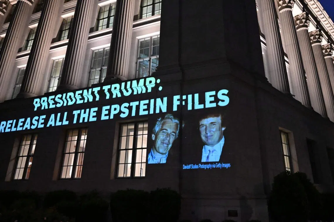 A message calling on US President Donald Trump to release all files related to Jeffrey Epstein is projected onto the US Chamber of Commerce building across from the White House in Washington, DC, on July 18.