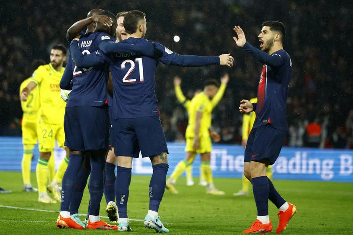 Soccer Football - Ligue 1 - Paris St Germain v Nantes - Parc des Princes, Paris, France - December 9, 2023 Paris St Germain's Randal Kolo Muani celebrates scoring their second goal with teammates REUTERS/Sarah Meyssonnier